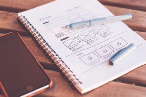 Notebook with sketches and smartphone